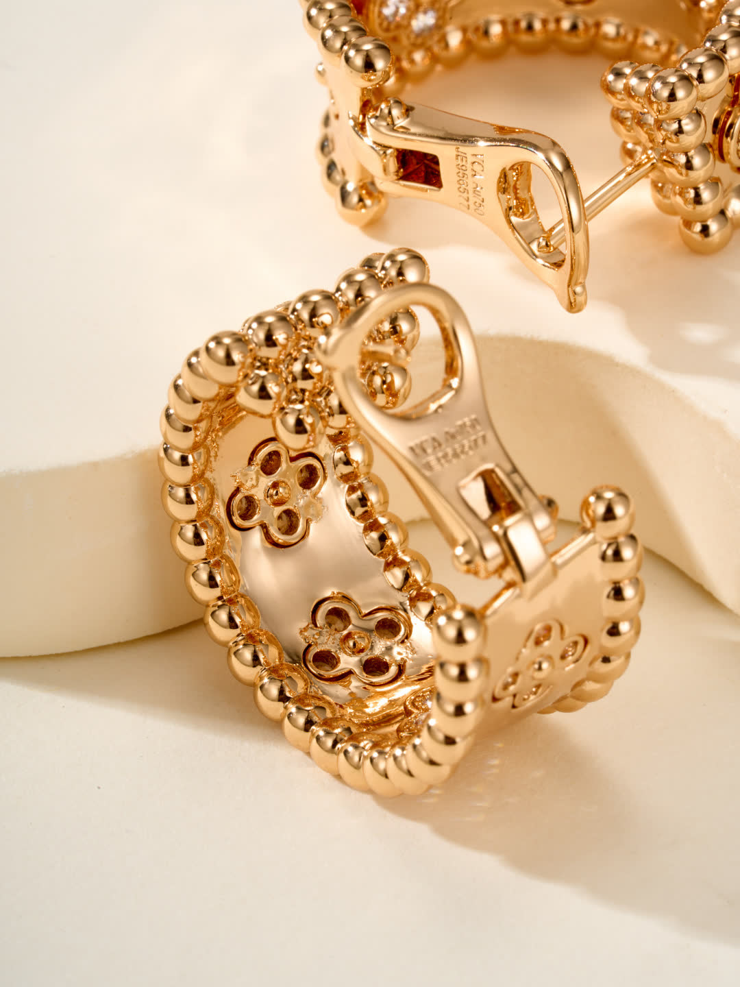 Van Cleef & Arpels Elegant Gold and Silver Hoop Earrings with Diamond Accents